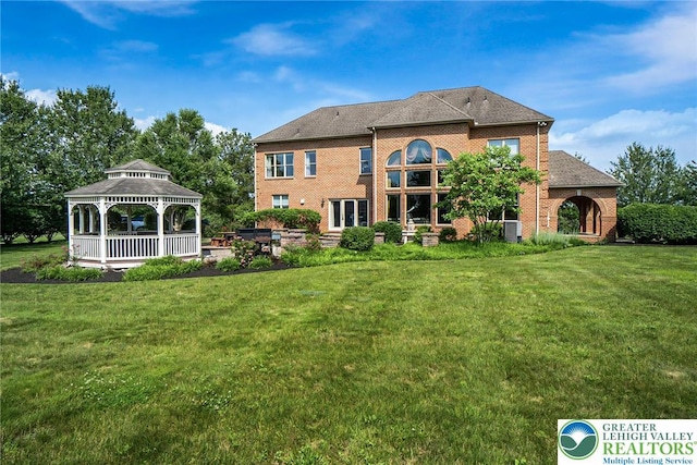 4260 W Wyndemere Cir, Lowhill Twp, PA 18078 - back of house with a gazebo, a yard, and brick siding