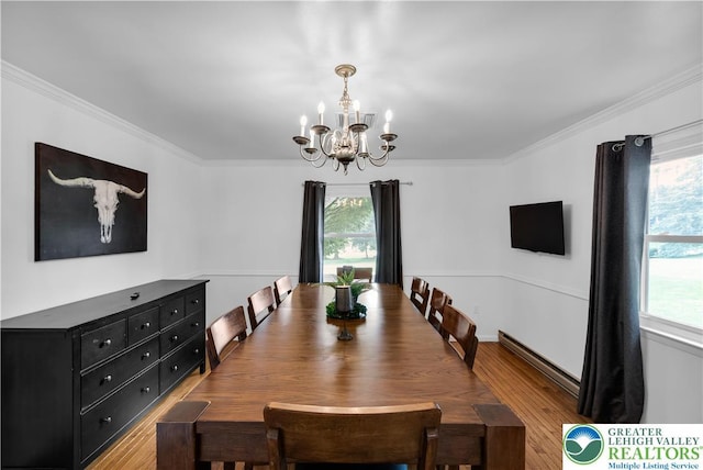 8555 Mohr Ln, Weisenberg Twp, PA 18051 - dining area with a chandelier, wood finished floors, and ornamental molding
