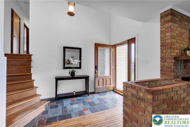 8555 Mohr Ln, Weisenberg Twp, PA 18051 - entryway featuring stairs and dark stone finish flooring