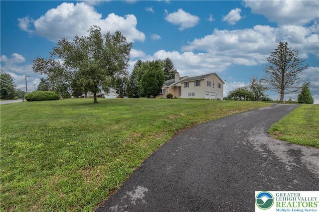 8555 Mohr Ln, Weisenberg Twp, PA 18051 - view of home's exterior featuring a lawn and a chimney
