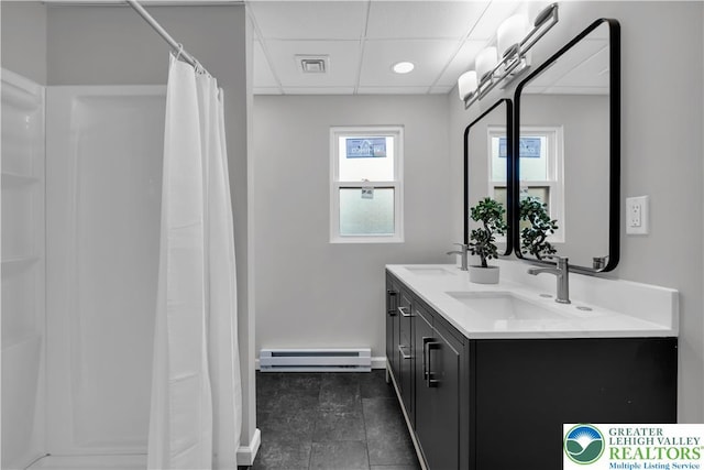 8555 Mohr Ln, Weisenberg Twp, PA 18051 - full bathroom featuring a baseboard radiator, double vanity, a drop ceiling, curtained shower, and tile patterned floors