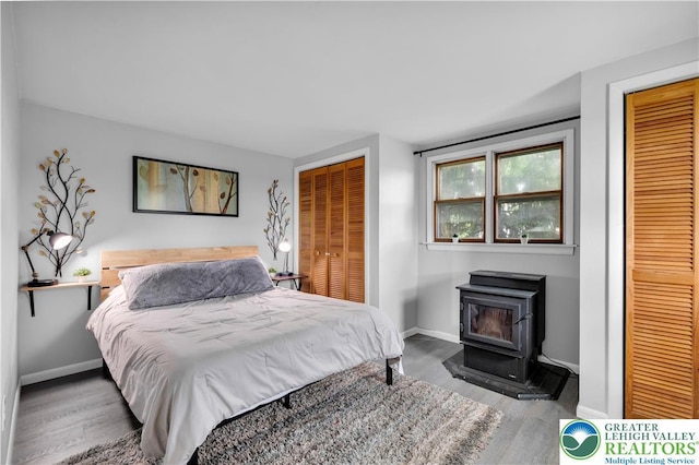 8555 Mohr Ln, Weisenberg Twp, PA 18051 - bedroom featuring a wood stove and wood finished floors