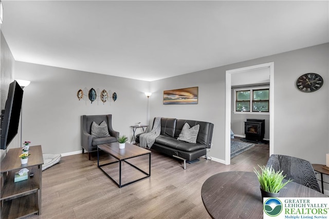 8555 Mohr Ln, Weisenberg Twp, PA 18051 - living room featuring wood finished floors and a wood stove