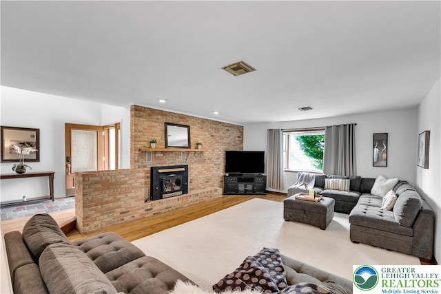 8555 Mohr Ln, Weisenberg Twp, PA 18051 - living area featuring wood finished floors, a fireplace, and recessed lighting