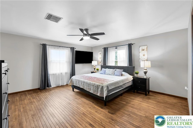 8555 Mohr Ln, Weisenberg Twp, PA 18051 - bedroom featuring multiple windows, hardwood / wood-style floors, and a ceiling fan