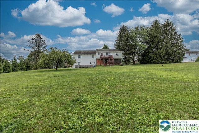 8555 Mohr Ln, Weisenberg Twp, PA 18051 - view of green lawn featuring stairway and a wooden deck