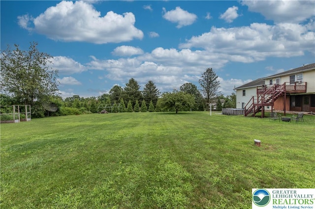 8555 Mohr Ln, Weisenberg Twp, PA 18051 - view of grassy yard with stairway and a wooden deck