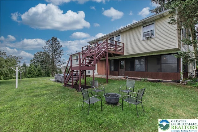 8555 Mohr Ln, Weisenberg Twp, PA 18051 - view of grassy yard featuring stairs, an outdoor fire pit, a wooden deck, and cooling unit