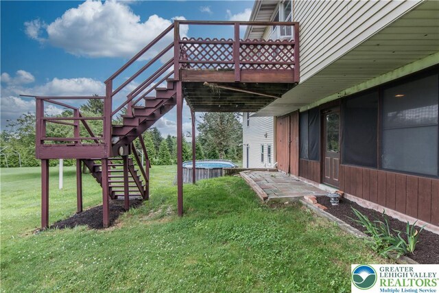 8555 Mohr Ln, Weisenberg Twp, PA 18051 - view of grassy yard with stairs, a jacuzzi, and a wooden deck