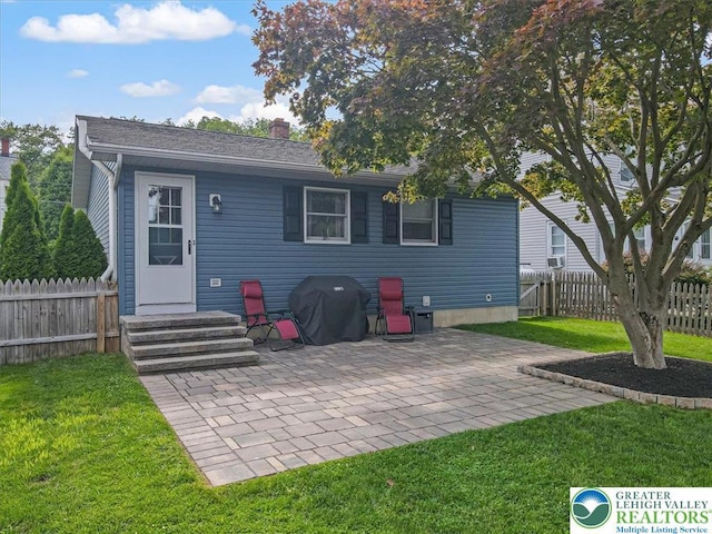5129 3rd St, Whitehall Twp, PA 18052 - back of house featuring a patio area, entry steps, and a chimney