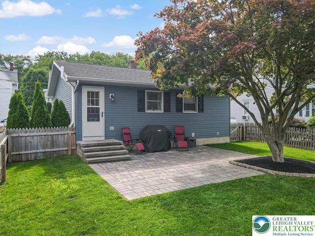 5129 3rd St, Whitehall Twp, PA 18052 - back of house featuring a patio and a chimney