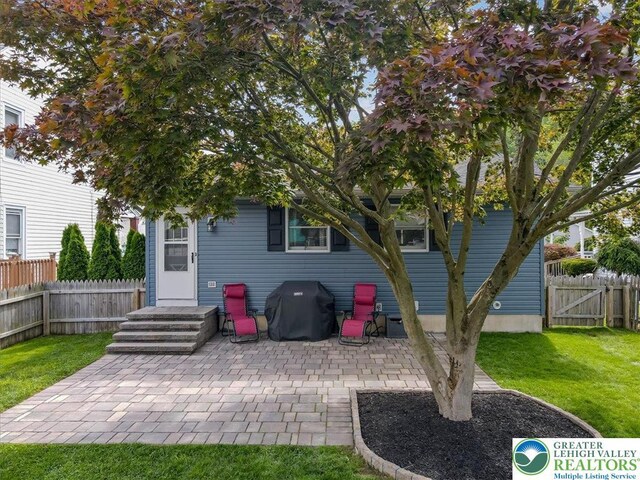 5129 3rd St, Whitehall Twp, PA 18052 - rear view of property with a patio