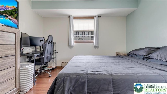 5129 3rd St, Whitehall Twp, PA 18052 - bedroom featuring wood finished floors, baseboard heating, and an office area
