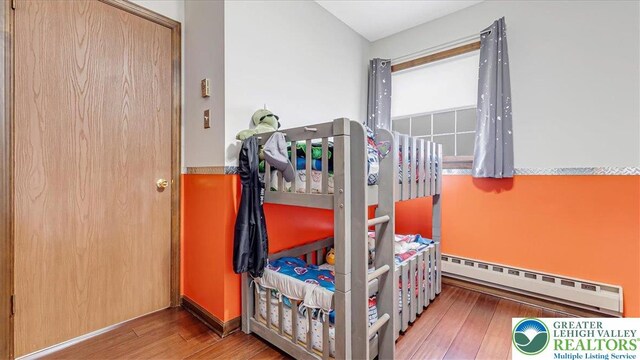 5129 3rd St, Whitehall Twp, PA 18052 - bedroom featuring a baseboard radiator and wood-type flooring