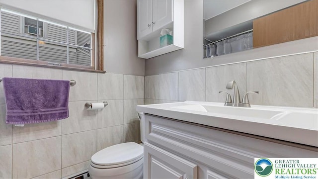 5129 3rd St, Whitehall Twp, PA 18052 - bathroom with vanity and tile walls