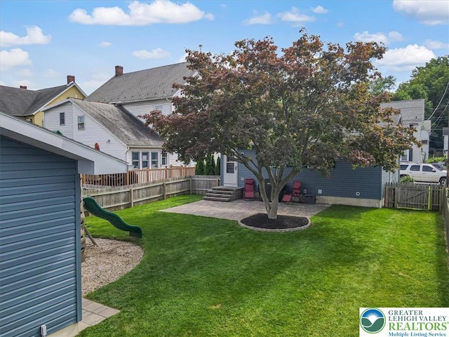 5129 3rd St, Whitehall Twp, PA 18052 - fenced backyard featuring a patio and entry steps
