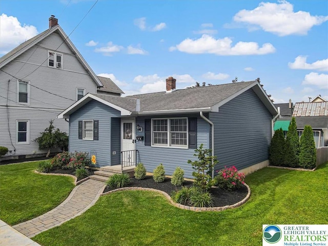 5129 3rd St, Whitehall Twp, PA 18052 - view of front facade featuring a chimney, a front lawn, and roof with shingles