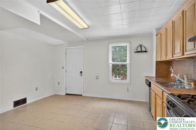 22 N Warren St, Easton, PA 18042 - kitchen featuring decorative backsplash, light tile patterned floors, range with gas cooktop, and dishwasher