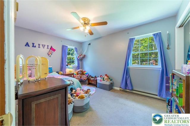 2175 Village Rd, Chestnuthill Twp, PA 18330 - bedroom with multiple windows, carpet, baseboard heating, and a ceiling fan