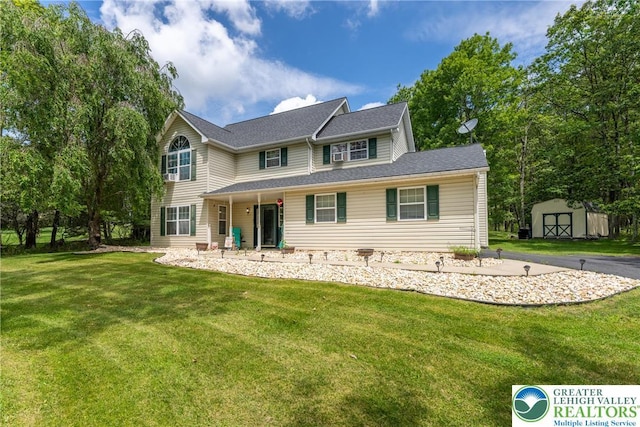 2175 Village Rd, Chestnuthill Twp, PA 18330 - view of front of home featuring a storage unit and a front yard