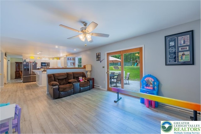 2175 Village Rd, Chestnuthill Twp, PA 18330 - living room featuring light wood finished floors, a ceiling fan, a baseboard heating unit, and recessed lighting