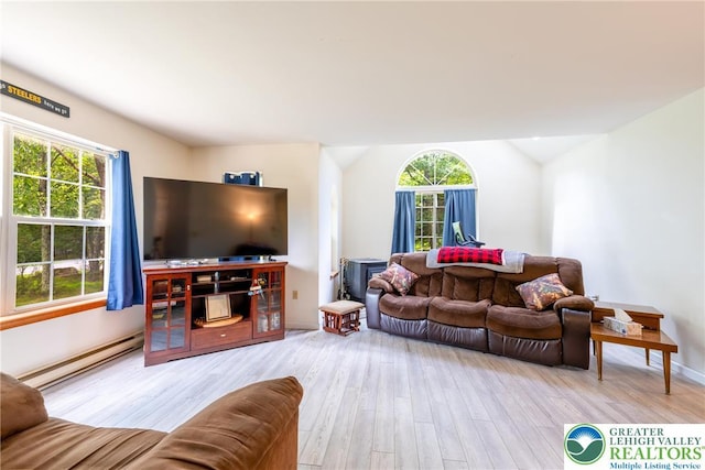 2175 Village Rd, Chestnuthill Twp, PA 18330 - living area with a baseboard heating unit, wood finished floors, plenty of natural light, and vaulted ceiling