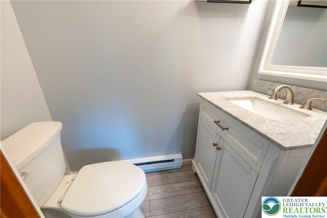 2175 Village Rd, Chestnuthill Twp, PA 18330 - bathroom featuring vanity, a baseboard radiator, and wood finished floors