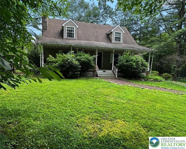 1701 Johns Rd, Chestnuthill Twp, PA 18330 - view of front of property featuring a front lawn, covered porch, a chimney, and roof with shingles