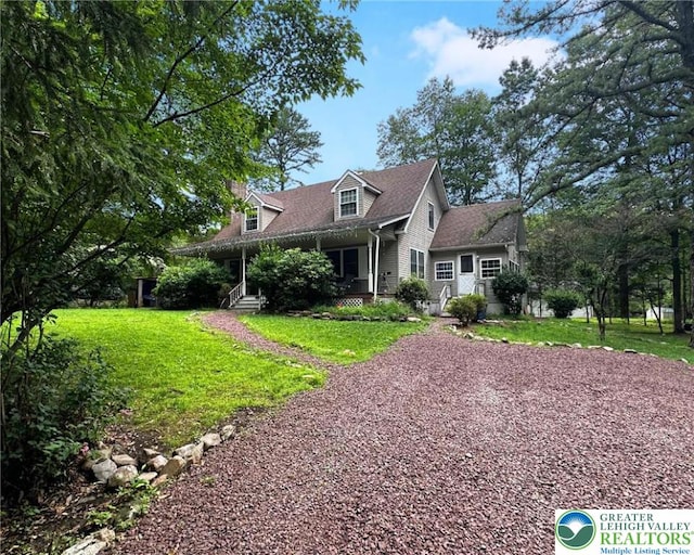 1701 Johns Rd, Chestnuthill Twp, PA 18330 - cape cod home featuring a front lawn, gravel driveway, and covered porch