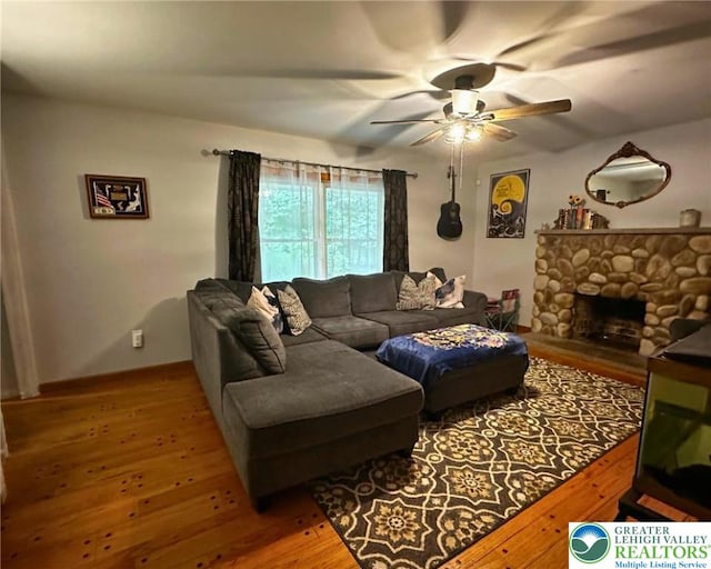 1701 Johns Rd, Chestnuthill Twp, PA 18330 - living room with wood-type flooring, a ceiling fan, and a fireplace