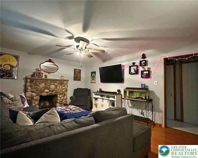 1701 Johns Rd, Chestnuthill Twp, PA 18330 - living room featuring a ceiling fan, wood finished floors, and a stone fireplace