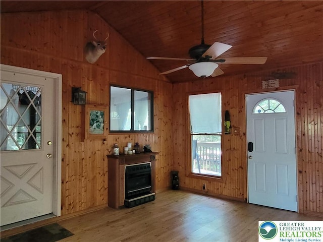 2048 Beaver Run Rd, Tobyhanna Twp, PA 18347 - foyer entrance with light wood-style flooring, ceiling fan, wood walls, vaulted ceiling, and wooden ceiling