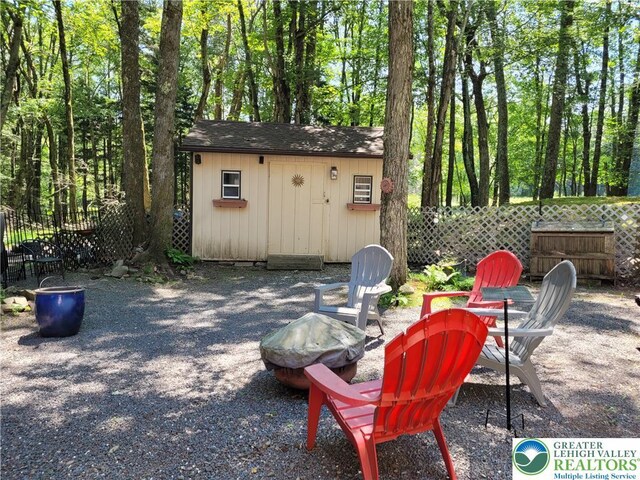 2048 Beaver Run Rd, Tobyhanna Twp, PA 18347 - view of patio featuring a fire pit and a shed