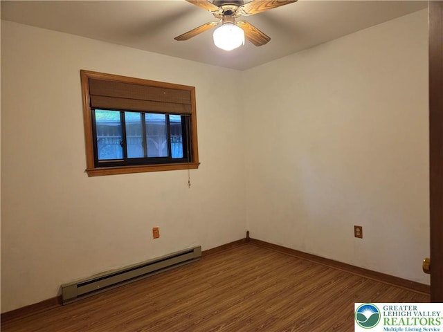 2048 Beaver Run Rd, Tobyhanna Twp, PA 18347 - unfurnished room featuring baseboard heating, wood finished floors, and a ceiling fan