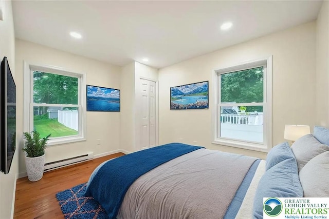 428 Shook Ave, Stroud Twp, PA 18360 - bedroom featuring a baseboard radiator, wood finished floors, and recessed lighting