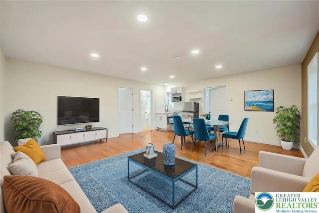 428 Shook Ave, Stroud Twp, PA 18360 - living room featuring light wood finished floors and recessed lighting