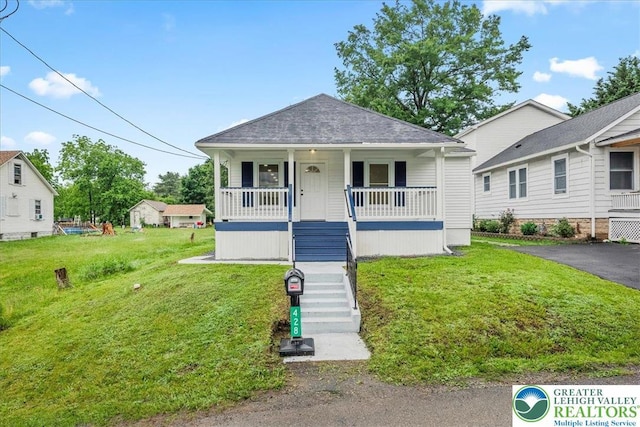428 Shook Ave, Stroud Twp, PA 18360 - bungalow-style house featuring covered porch, a front lawn, and stairs