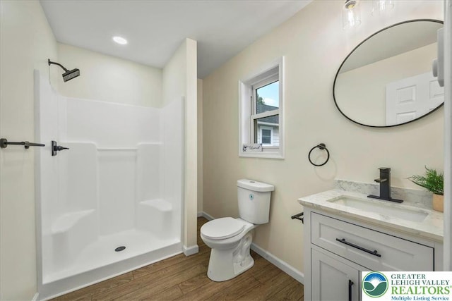 428 Shook Ave, Stroud Twp, PA 18360 - full bathroom with wood finished floors, vanity, and a shower