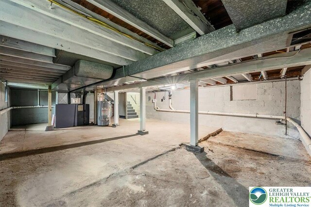 428 Shook Ave, Stroud Twp, PA 18360 - unfinished below grade area featuring water heater and stairway