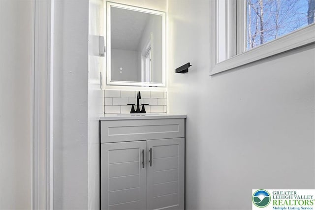 182 Maxatawny Dr, Coolbaugh Twp, PA 18347 - bathroom with decorative backsplash and vanity