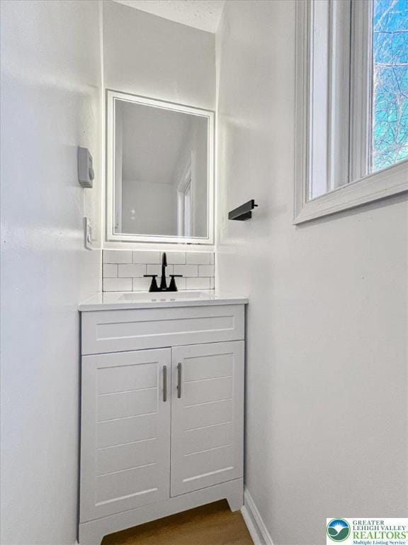 182 Maxatawny Dr, Coolbaugh Twp, PA 18347 - bathroom featuring vanity and tasteful backsplash