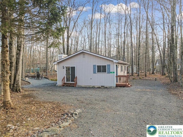 182 Maxatawny Dr, Coolbaugh Twp, PA 18347 - view of side of property featuring a chimney
