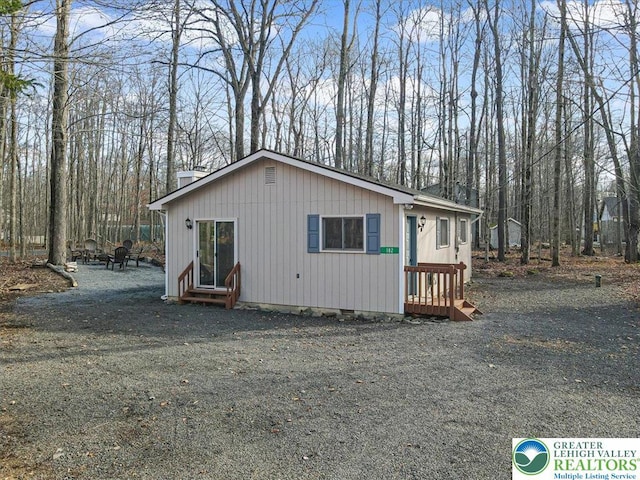 182 Maxatawny Dr, Coolbaugh Twp, PA 18347 - view of front of property featuring a chimney and entry steps