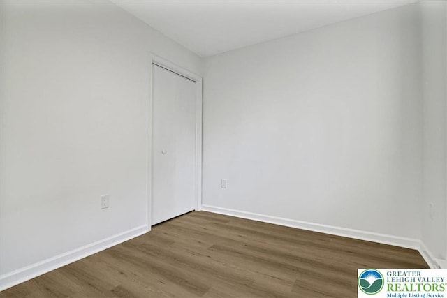 182 Maxatawny Dr, Coolbaugh Twp, PA 18347 - unfurnished bedroom featuring wood finished floors and a closet