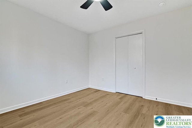 182 Maxatawny Dr, Coolbaugh Twp, PA 18347 - unfurnished bedroom featuring wood finished floors, a closet, and ceiling fan