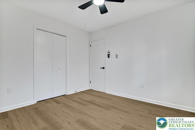 182 Maxatawny Dr, Coolbaugh Twp, PA 18347 - unfurnished bedroom featuring wood finished floors, a closet, and a ceiling fan