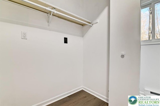 182 Maxatawny Dr, Coolbaugh Twp, PA 18347 - laundry room featuring dark wood-style flooring, electric dryer hookup, and a baseboard radiator