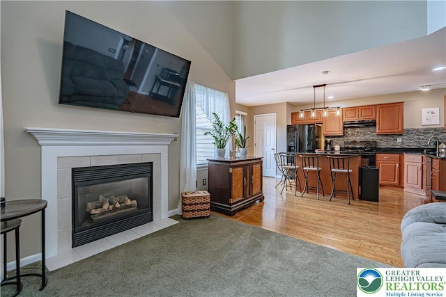 2877 Hope Ridge Dr, Bethlehem Twp, PA 18045 - living room featuring light carpet and a tiled fireplace
