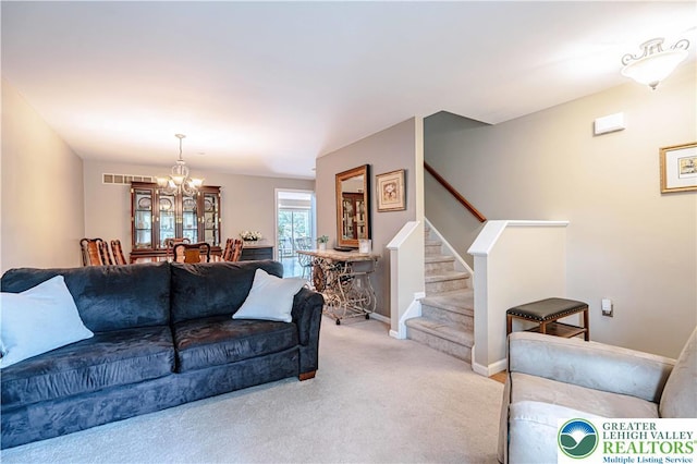 2877 Hope Ridge Dr, Bethlehem Twp, PA 18045 - carpeted living room featuring stairway and a chandelier
