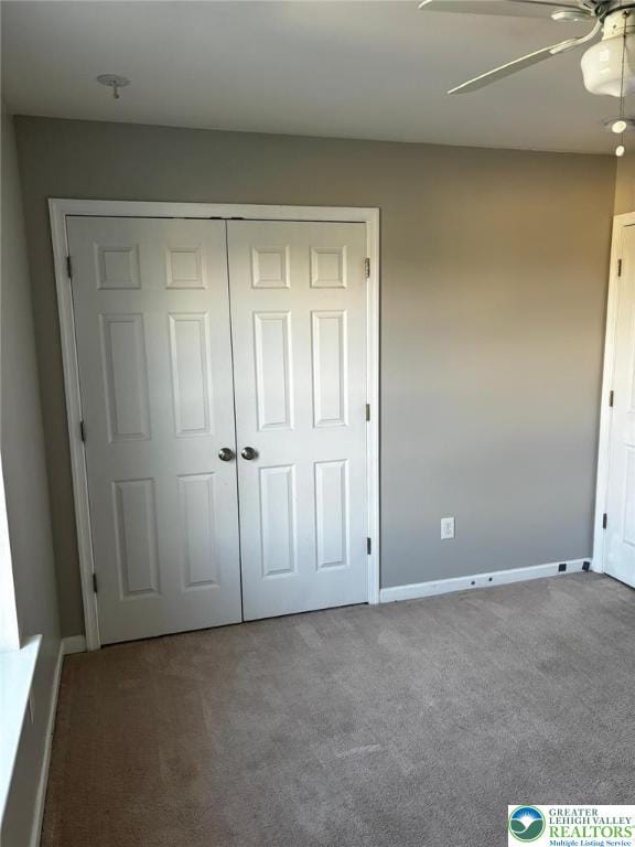 4954 Coatbridge Ln, Lehigh Twp, PA 18088 - unfurnished bedroom with carpet floors, a closet, and a ceiling fan